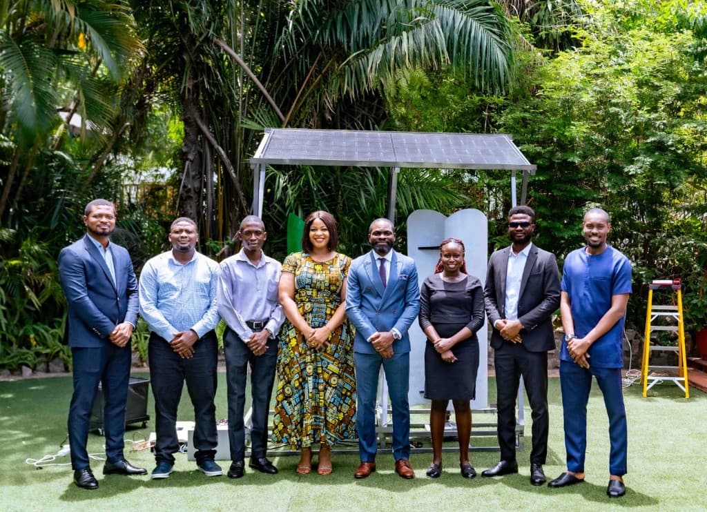 Anfani team with a solar installation outdoors